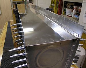 Laid the back tank baffle into position