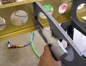 Started riveting the ribs to the front spar