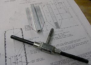 Put the 3/8 inch tap into the tie-down bar