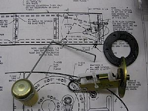 Bent the fuel float arm to the suggested dimensions 