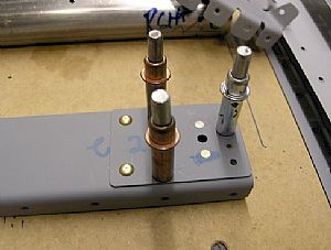 Riveted on the K1000-3 platenuts to both spars
