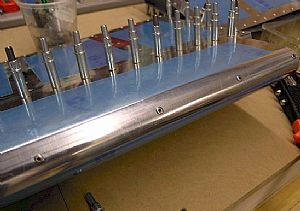 Blind riveted the A-909 counterbalance to the A-901A nose skin