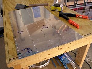 Finished dimpling and sanding the inboard doubler plate