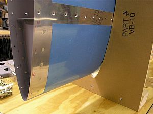 Started on riveting the front ribs to the skin
