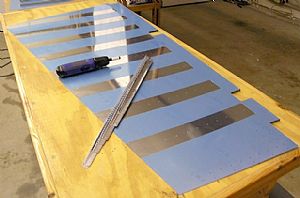 Deburred the left rudder skin and stiffener holes