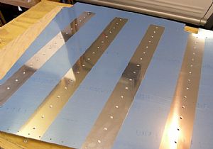 Dimpled the left rudder skin and the stiffeners