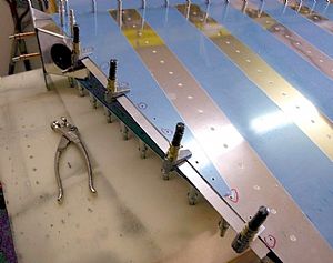 Clamped on first R-918 bottom strip