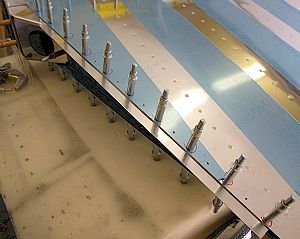 Final drilled R-918 bottom strips to rudder