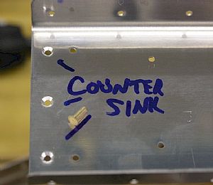 Countersinked the E-902 spar for the flat head rivets that will attach the E-906 rib