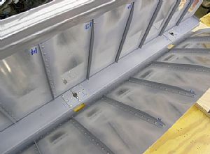 Riveted on the spar and back riveted the other stiffeners