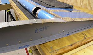 Riveted the counterbalance assembly to the front spar