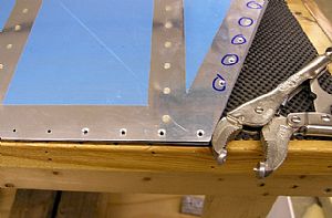 Dimpled the holes in trailing edge skin