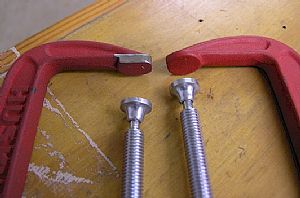 Getting ready to drill the forward side skin and longeron holes into the firewall bracket