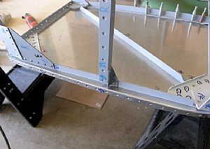 Rivet the F-719 to the vertical angle of the firewall