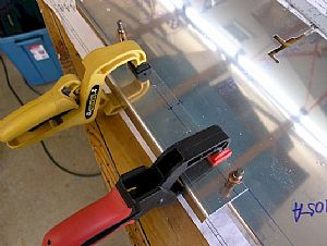 Drilled and clecoed rear F-746 engine control bracket