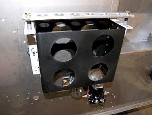 Bolted on the battery box