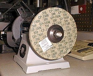 Put the new wheel on the bench grinder